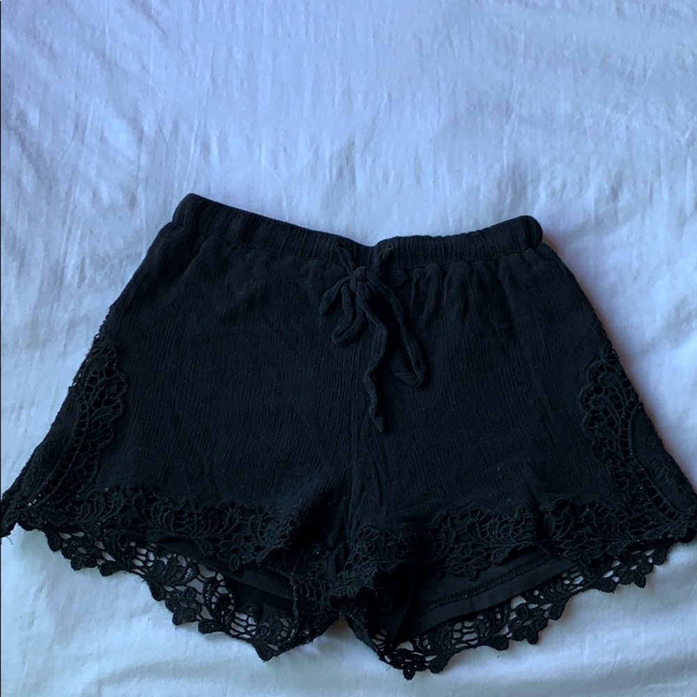 Black scalloped crochet detailed shorts